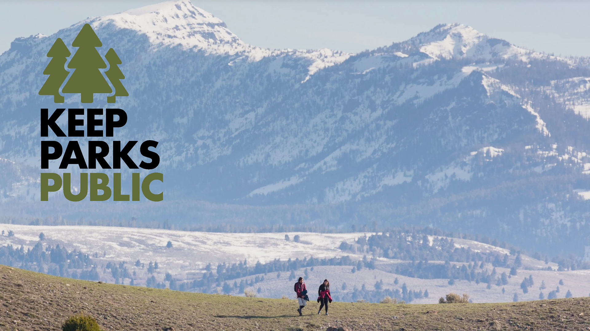 Keep Parks Public logo on top of a background of a mountainscape with two people hiking.