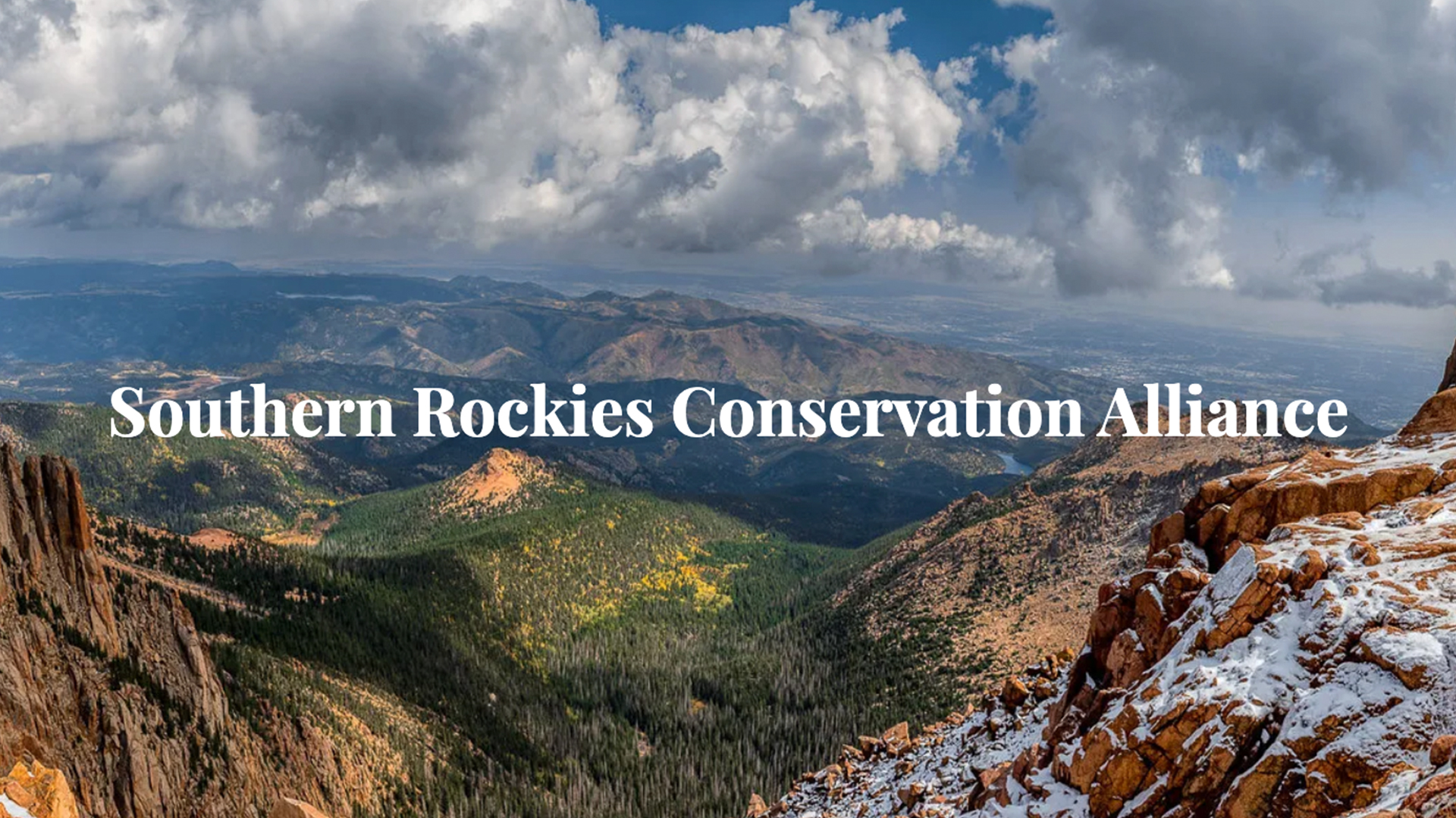 The text Southern Rockies Conservation Alliance on top of a mountainscape